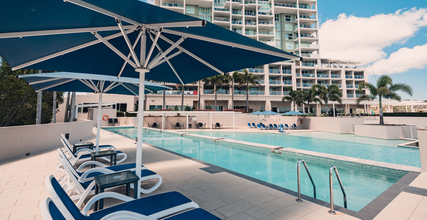 Enjoy a dip in the pool at Pelican Waters Resort Caloundra 