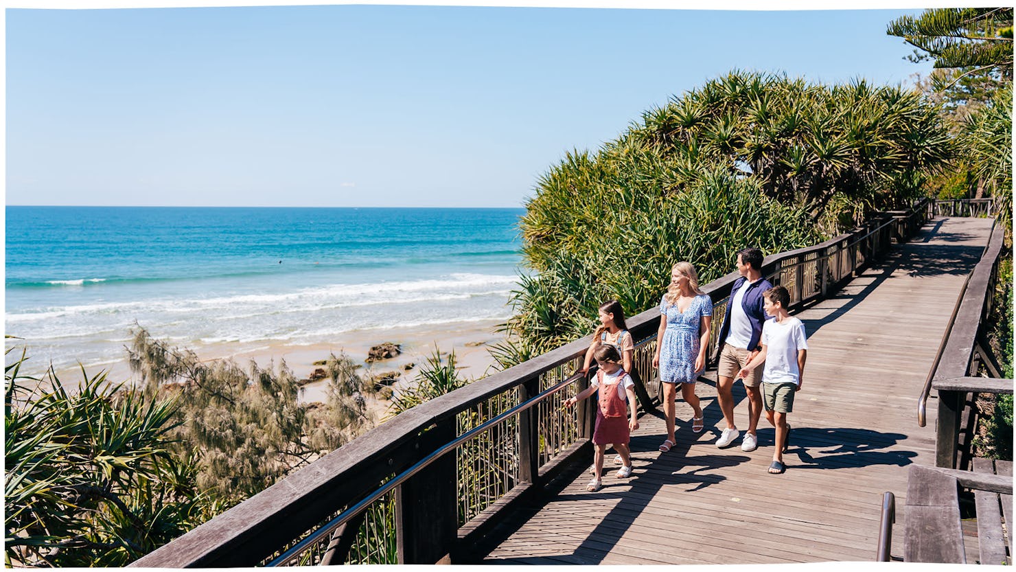 Family on boardwalk at Coolum Beach